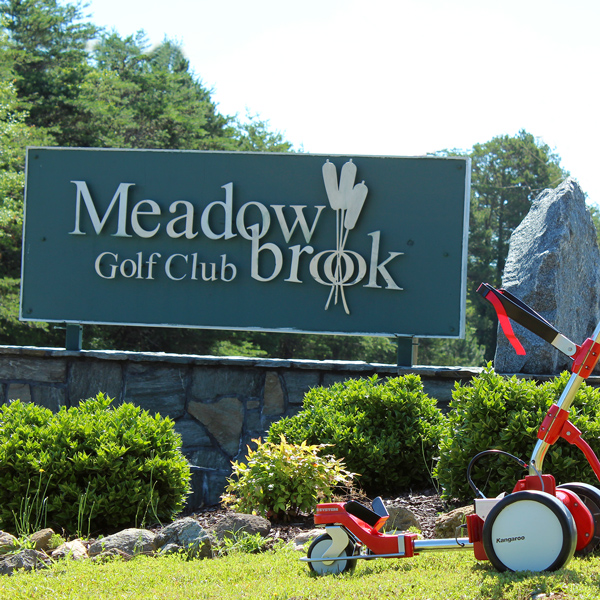 Meadowbrook Golf Club sign with Kangaroo caddie in front of it
